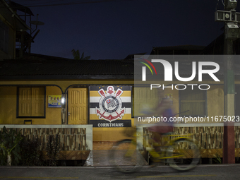 A man rides a bicycle in Afua, Para, Brazil, on September 29, 2024. (