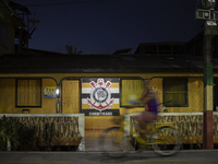 A man rides a bicycle in Afua, Para, Brazil, on September 29, 2024. (