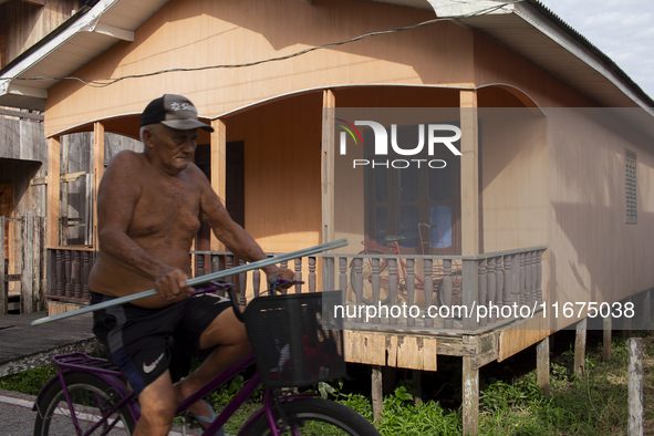 A man rides a bicycle in the streets of the city known as the city of bicycles in Afua, Para, Brazil, on September 30, 2024. 