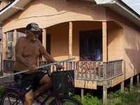 A man rides a bicycle in the streets of the city known as the city of bicycles in Afua, Para, Brazil, on September 30, 2024. (