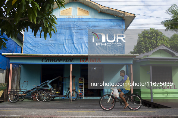 A man rides a bicycle in the streets of the city known as the city of bicycles in Afua, Para, Brazil, on September 30, 2024. 