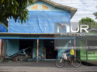 A man rides a bicycle in the streets of the city known as the city of bicycles in Afua, Para, Brazil, on September 30, 2024. (