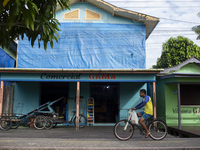 A man rides a bicycle in the streets of the city known as the city of bicycles in Afua, Para, Brazil, on September 30, 2024. (