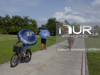 People ride bicycles in the streets of the city known as the city of bicycles, located at the mouth of the Amazon River, in Afua, Para, Braz...