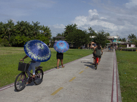 People ride bicycles in the streets of the city known as the city of bicycles, located at the mouth of the Amazon River, in Afua, Para, Braz...