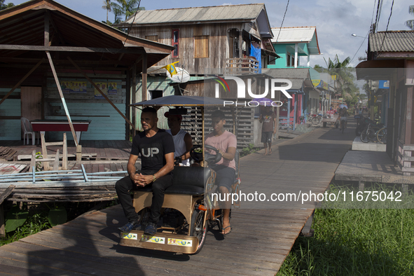 People ride bicycles in the streets of the city known as the city of bicycles, located at the mouth of the Amazon River, in Afua, Para, Braz...