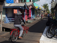 People ride bicycles in the streets of the city known as the city of bicycles, located at the mouth of the Amazon River, in Afua, Para, Braz...