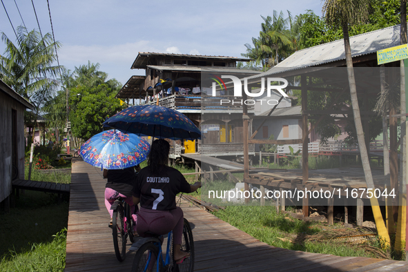 People ride bicycles in the streets of the city known as the city of bicycles, located at the mouth of the Amazon River, in Afua, Para, Braz...