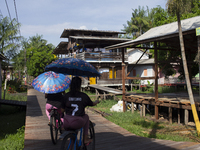 People ride bicycles in the streets of the city known as the city of bicycles, located at the mouth of the Amazon River, in Afua, Para, Braz...