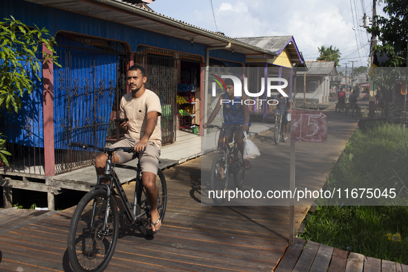 People ride bicycles in the streets of the city known as the city of bicycles, located at the mouth of the Amazon River, in Afua, Para, Braz...