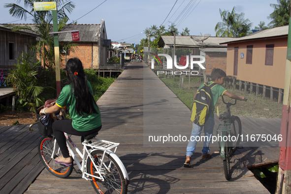 People ride bicycles in the streets of the city known as the city of bicycles, located at the mouth of the Amazon River, in Afua, Para, Braz...