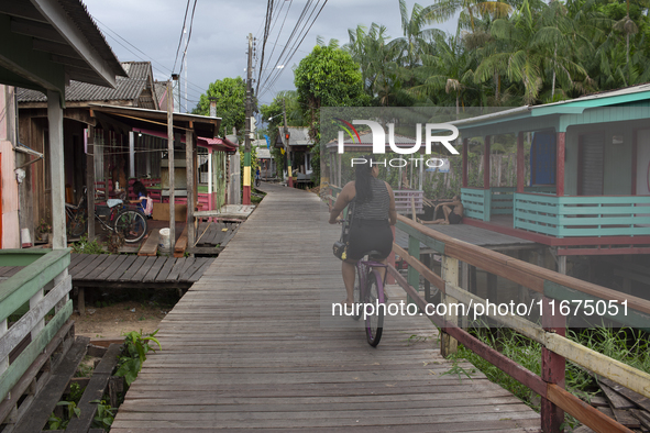 People ride bicycles in the streets of the city known as the city of bicycles, located at the mouth of the Amazon River, in Afua, Para, Braz...