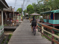 People ride bicycles in the streets of the city known as the city of bicycles, located at the mouth of the Amazon River, in Afua, Para, Braz...