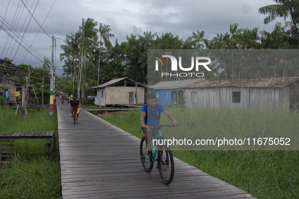 People ride bicycles in the streets of the city known as the city of bicycles, located at the mouth of the Amazon River, in Afua, Para, Braz...