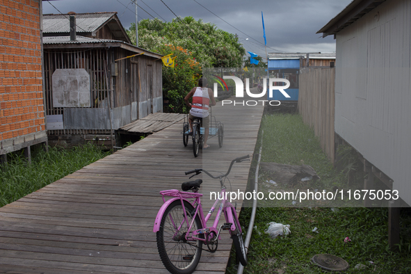 People ride bicycles in the streets of the city known as the city of bicycles, located at the mouth of the Amazon River, in Afua, Para, Braz...