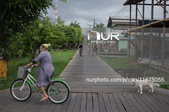 People ride bicycles in the streets of the city known as the city of bicycles, located at the mouth of the Amazon River, in Afua, Para, Braz...