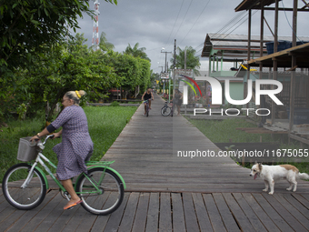 People ride bicycles in the streets of the city known as the city of bicycles, located at the mouth of the Amazon River, in Afua, Para, Braz...