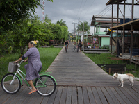 People ride bicycles in the streets of the city known as the city of bicycles, located at the mouth of the Amazon River, in Afua, Para, Braz...