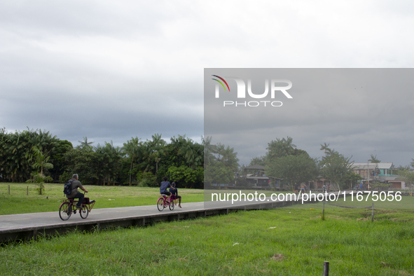 People ride bicycles in the streets of the city known as the city of bicycles, located at the mouth of the Amazon River, in Afua, Para, Braz...