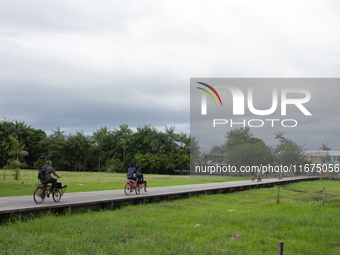 People ride bicycles in the streets of the city known as the city of bicycles, located at the mouth of the Amazon River, in Afua, Para, Braz...