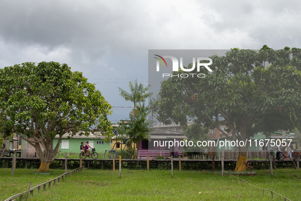 People ride bicycles in the streets of the city known as the city of bicycles, located at the mouth of the Amazon River, in Afua, Para, Braz...