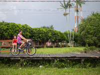 People ride bicycles in the streets of the city known as the city of bicycles, located at the mouth of the Amazon River, in Afua, Para, Braz...