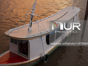 A typical Amazonian boat is at the mouth of the Amazon River in Afua, Para, Brazil, on October 1, 2024, during the evening. (