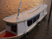 A typical Amazonian boat is at the mouth of the Amazon River in Afua, Para, Brazil, on October 1, 2024, during the evening. (