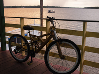 A bicycle parks at the mouth of the Amazon River in Afua, Para, Brazil, on October 1, 2024. (