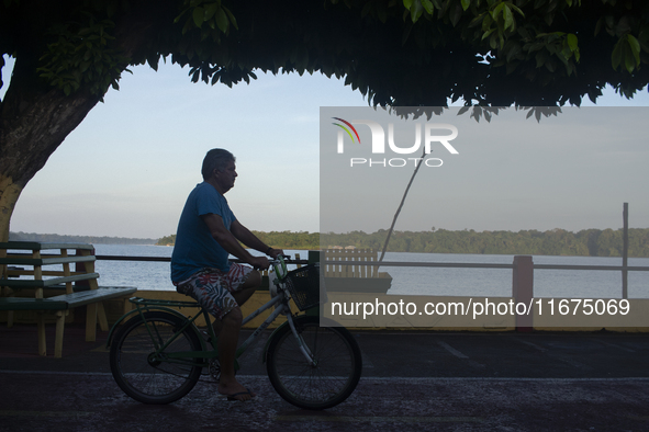 People ride bicycles in the streets of the city known as the city of bicycles, located at the mouth of the Amazon River, in Afua, Para, Braz...