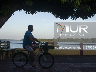 People ride bicycles in the streets of the city known as the city of bicycles, located at the mouth of the Amazon River, in Afua, Para, Braz...