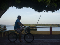 People ride bicycles in the streets of the city known as the city of bicycles, located at the mouth of the Amazon River, in Afua, Para, Braz...