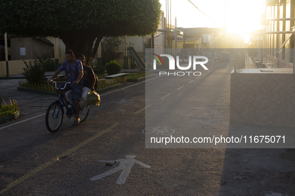 People ride bicycles in the streets of the city known as the city of bicycles, located at the mouth of the Amazon River, in Afua, Para, Braz...