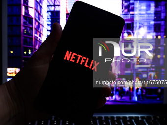 Netflix logo is screened on a mobile phone for illustration photo. Krakow, Poland on October 17th, 2024. (