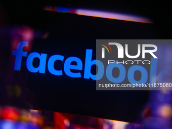 Facebook logo is screened on a mobile phone for illustration photo. Krakow, Poland on October 17th, 2024. (