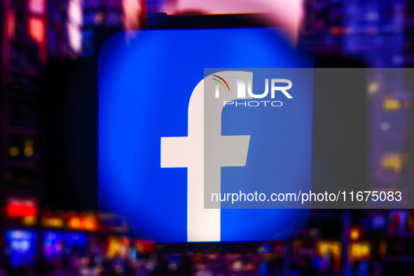 Facebook logo is screened on a mobile phone for illustration photo. Krakow, Poland on October 17th, 2024. 