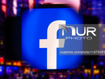 Facebook logo is screened on a mobile phone for illustration photo. Krakow, Poland on October 17th, 2024. (