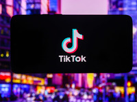 TikTok logo is screened on a mobile phone for illustration photo. Krakow, Poland on October 17th, 2024. (