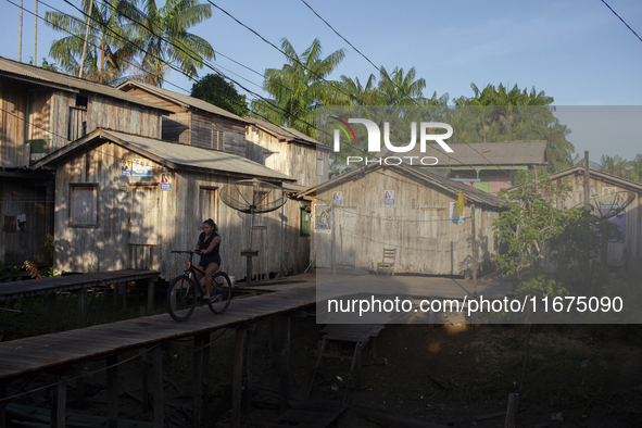 People ride bicycles in the streets of the city known as the city of bicycles, located at the mouth of the Amazon River, in Afua, Para, Braz...