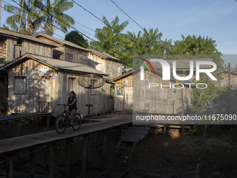 People ride bicycles in the streets of the city known as the city of bicycles, located at the mouth of the Amazon River, in Afua, Para, Braz...