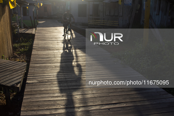 People ride bicycles in the streets of the city known as the city of bicycles, located at the mouth of the Amazon River, in Afua, Para, Braz...