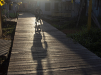 People ride bicycles in the streets of the city known as the city of bicycles, located at the mouth of the Amazon River, in Afua, Para, Braz...