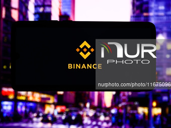 Binance logo is screened on a mobile phone for illustration photo. Krakow, Poland on October 17th, 2024. (