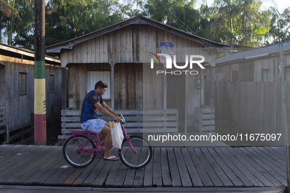 People ride bicycles in the streets of the city known as the city of bicycles, located at the mouth of the Amazon River, in Afua, Para, Braz...