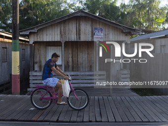 People ride bicycles in the streets of the city known as the city of bicycles, located at the mouth of the Amazon River, in Afua, Para, Braz...