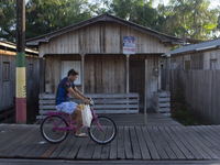 People ride bicycles in the streets of the city known as the city of bicycles, located at the mouth of the Amazon River, in Afua, Para, Braz...