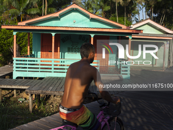 People ride bicycles in the streets of the city known as the city of bicycles, located at the mouth of the Amazon River, in Afua, Para, Braz...