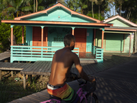 People ride bicycles in the streets of the city known as the city of bicycles, located at the mouth of the Amazon River, in Afua, Para, Braz...