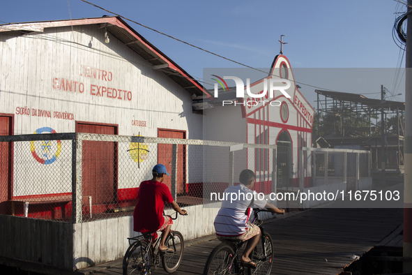 People ride bicycles in the streets of the city known as the city of bicycles, located at the mouth of the Amazon River, in Afua, Para, Braz...