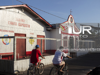 People ride bicycles in the streets of the city known as the city of bicycles, located at the mouth of the Amazon River, in Afua, Para, Braz...